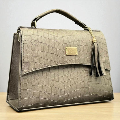 Bolsa TERESA femenina croco elegante color dorado, con tassel moderno y estilo sofisticado